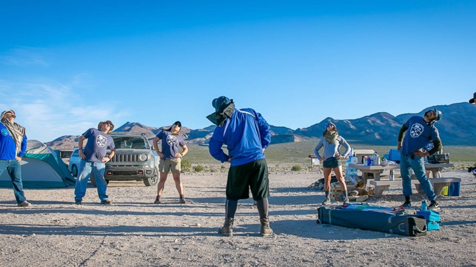<p>On a trip to Death Valley National Park, veterans take part in some mindful movement, including yoga stretches.</p>