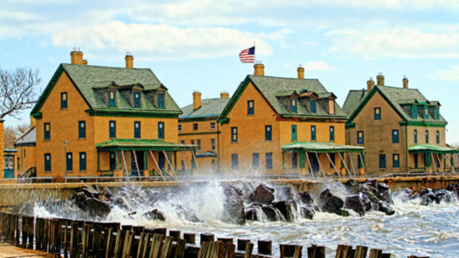 <p>Storm surge pounds the deteriorating seawall at Fort Hancock which serves as the only defense protecting historic buildings from high tides and coastal storms on Officers Row at Sandy Hook, Gateway National Recreation Area.</p>