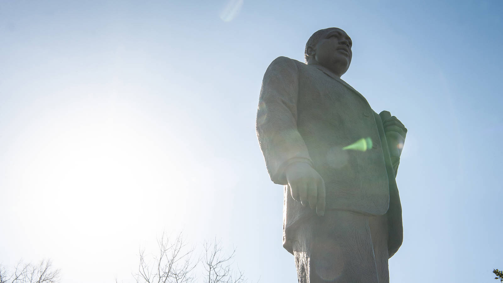 <p>A sculpture dedicated to Martin Luther King Jr. stands in Kelly Ingram Park.</p>