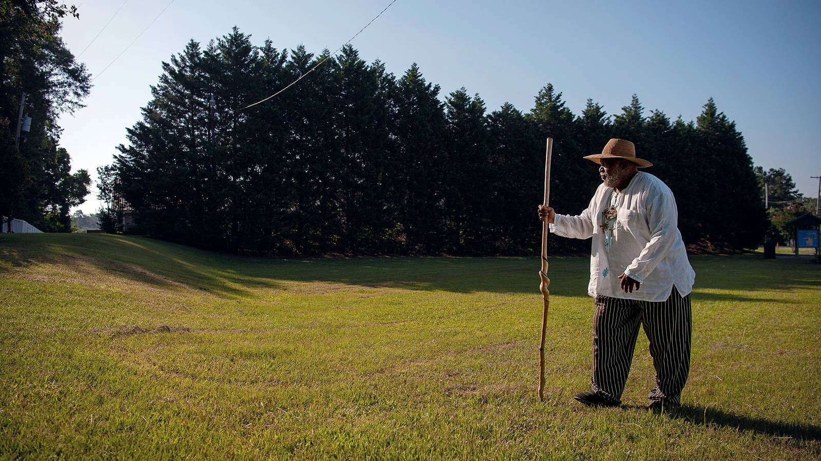 <p>Longtime advocate Ser Seshsh Ab Heter-C.M. Boxley walks across Forks of the Road in Natchez, Mississippi. Owing in part to Ser Boxley’s persistence, the landmark was recently added to Natchez National Historical Park.</p>