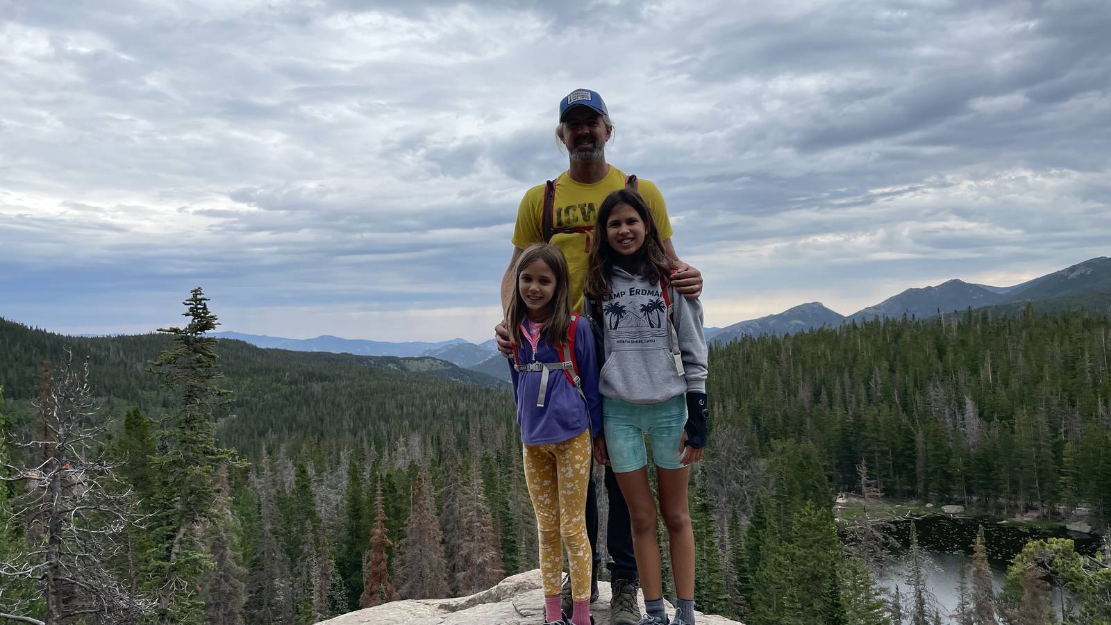 <p>Chris &amp; his daughters on a hike</p>
