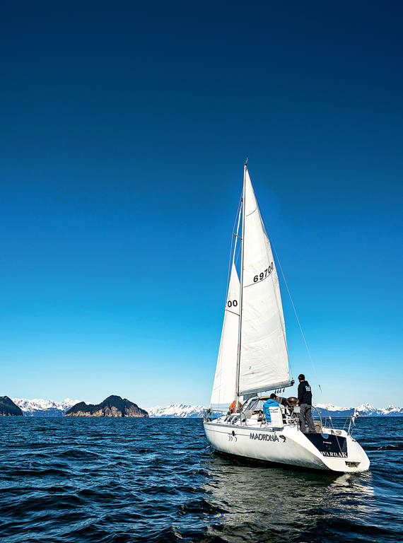 <p>On a rare blue-sky day, the group sails in waters off Kenai Fjords National Park. Wolfrom took this photo from the dinghy rather than using his drone, in part because of the machine's disastrous first outing.  </p>