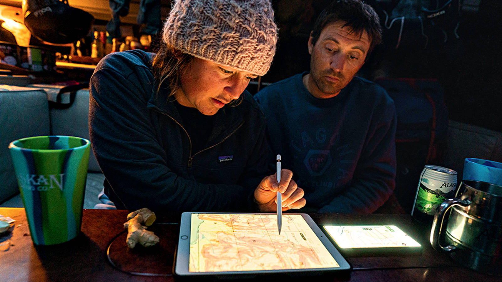 <p>Griffith and Chaney plot out the next day’s routes in the cozy cabin of the Madrona.</p>