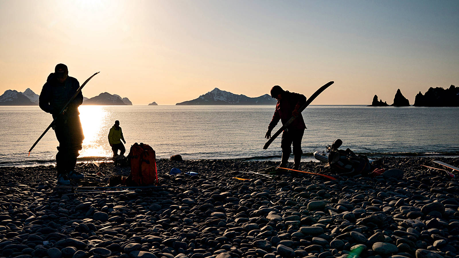 <p>Sunrise finds the team on the shore of Bulldog Cove, preparing for another day of backcountry skiing.</p>