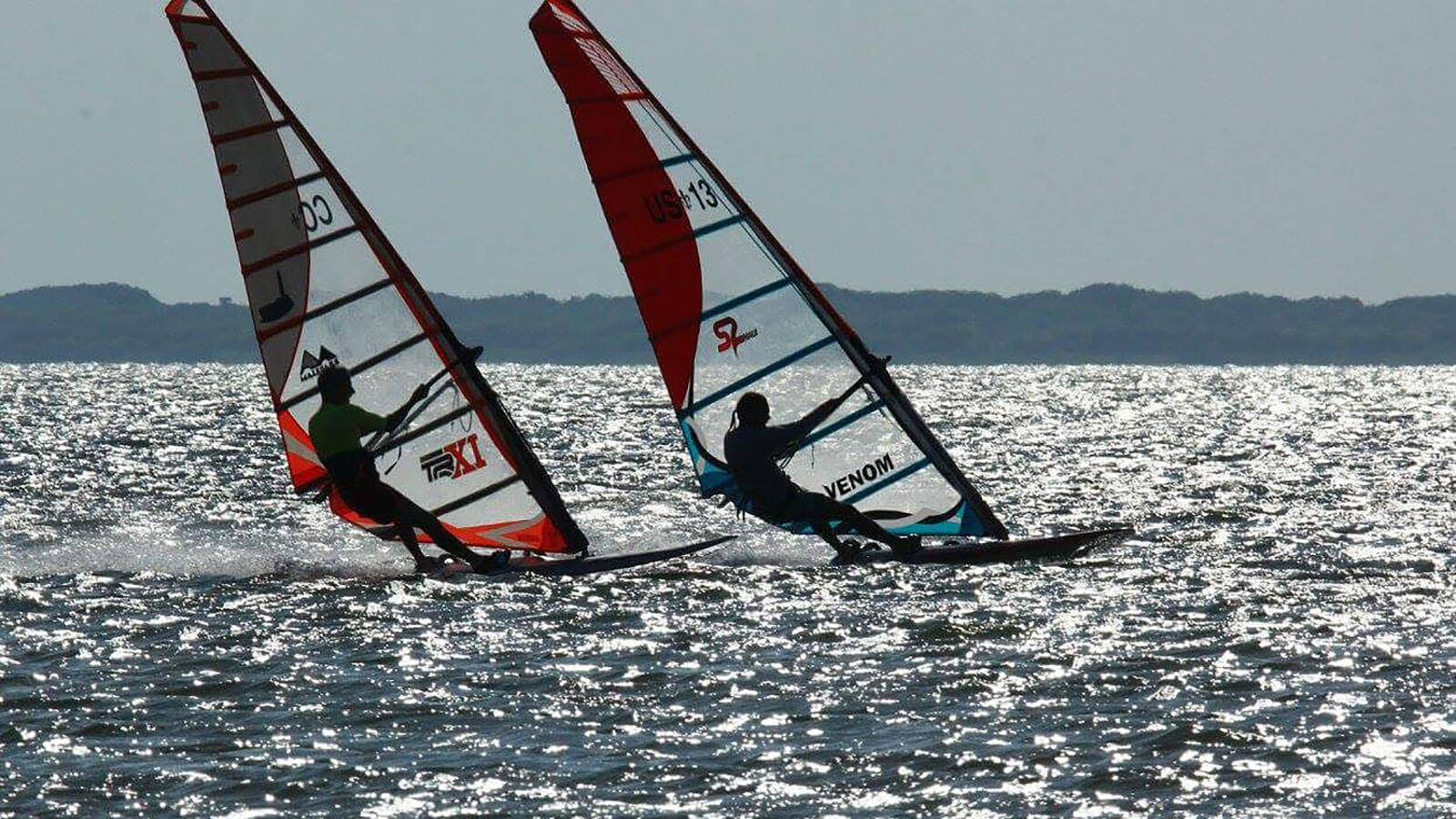 <p>Olivier Jallais (right), the author’s windsurfing instructor, skims down the Laguna Madre, a premier destination for the sport. </p>
