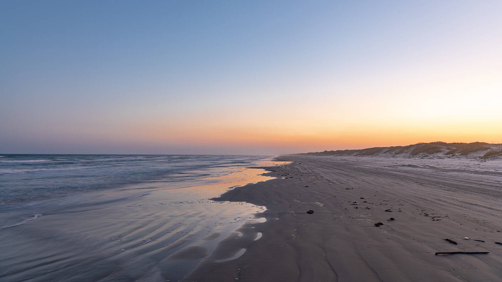 <p>Miles of tide-washed shore and windswept grasslands make Padre Island a favorite for those searching for solitude along Texas’ Gulf Coast.</p>