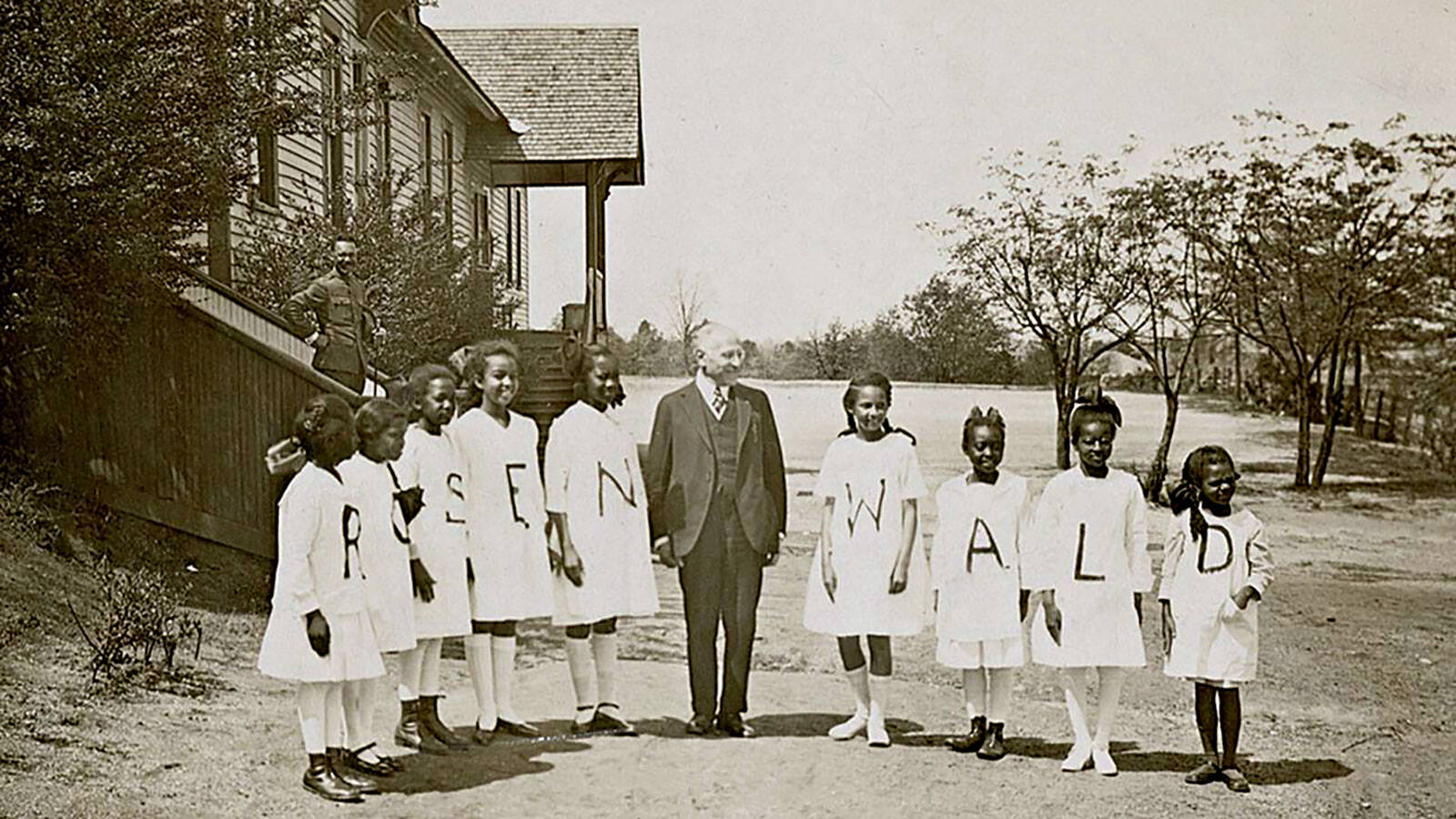 <p>Students pose with Rosenwald at the Tuskegee Institute.</p>