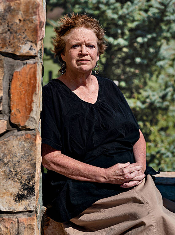 <p>Lisa Custalow, pictured here at the Rockingham County memorial, is still conflicted about the park’s creation. “My heart breaks for what the families have had to go through,” she said. “And yet the views up there — it’s a beautiful park, and it’s for everybody, and it has benefited so many people.”</p>
<p class="MsoNormal">Her mother, Etolia Shifflett, was born on Hightop Mountain in Rockingham County in 1933. The family was pushed out soon after. Many displaced families never talked about their mountain heritage due to negative stereotypes about “hillbillies.” Though the relocation was a painful subject, Custalow did once ask her mother how their family left, knowing some people went quietly while others resisted. “I wanted to hear, ‘Grandma was out on the porch with a shotgun,’” Custalow recalled. “But my mother said, ‘They told us we had to leave, and we left. You can’t fight the government.’ That wasn’t what I wanted to hear. But that was the feeling then, for most people.”</p>