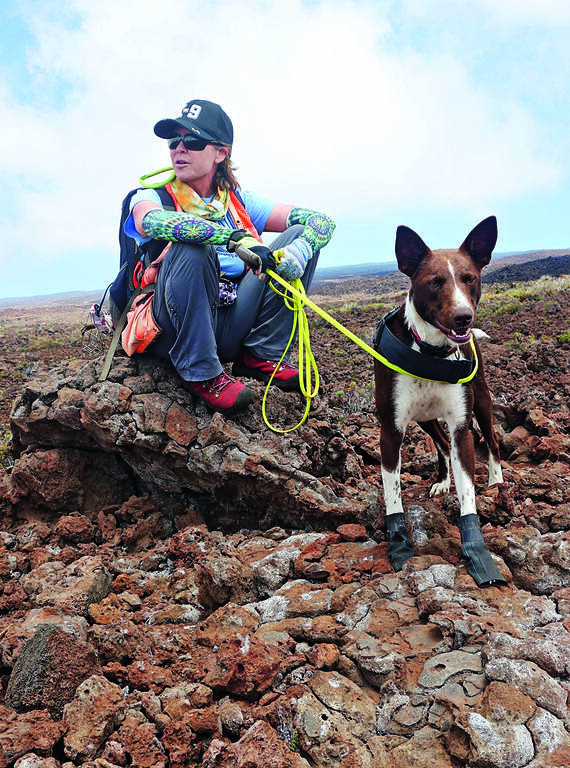 <p>Two-year-old Slater with biologist Michelle Reynolds, who adopted him when he was a puppy.</p>