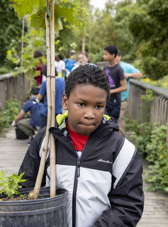 <p>Youth with the Anacostia Watershed Society's Saturday Environmental Academy participate in a tree planting along the Anacostia Riverwalk Trail. </p>