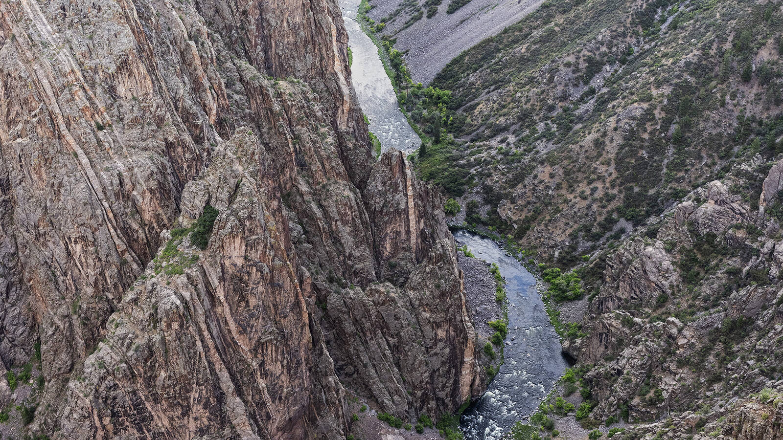<p>The canyon is 48 miles long and, in one spot, more than 2,700 feet deep. This precipitous drop gives the Black Canyon its name: Some segments of its floor receive less than an hour of daily sunlight.</p>