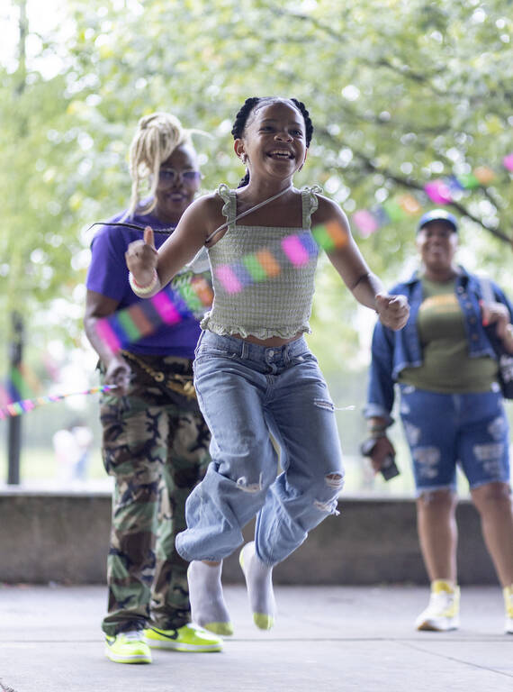 <p>Harmony Buckett, 10, jumps rope at the Anacostia Park skating pavilion, a beloved gathering place in the park — and the only skating rink in the park system.</p>