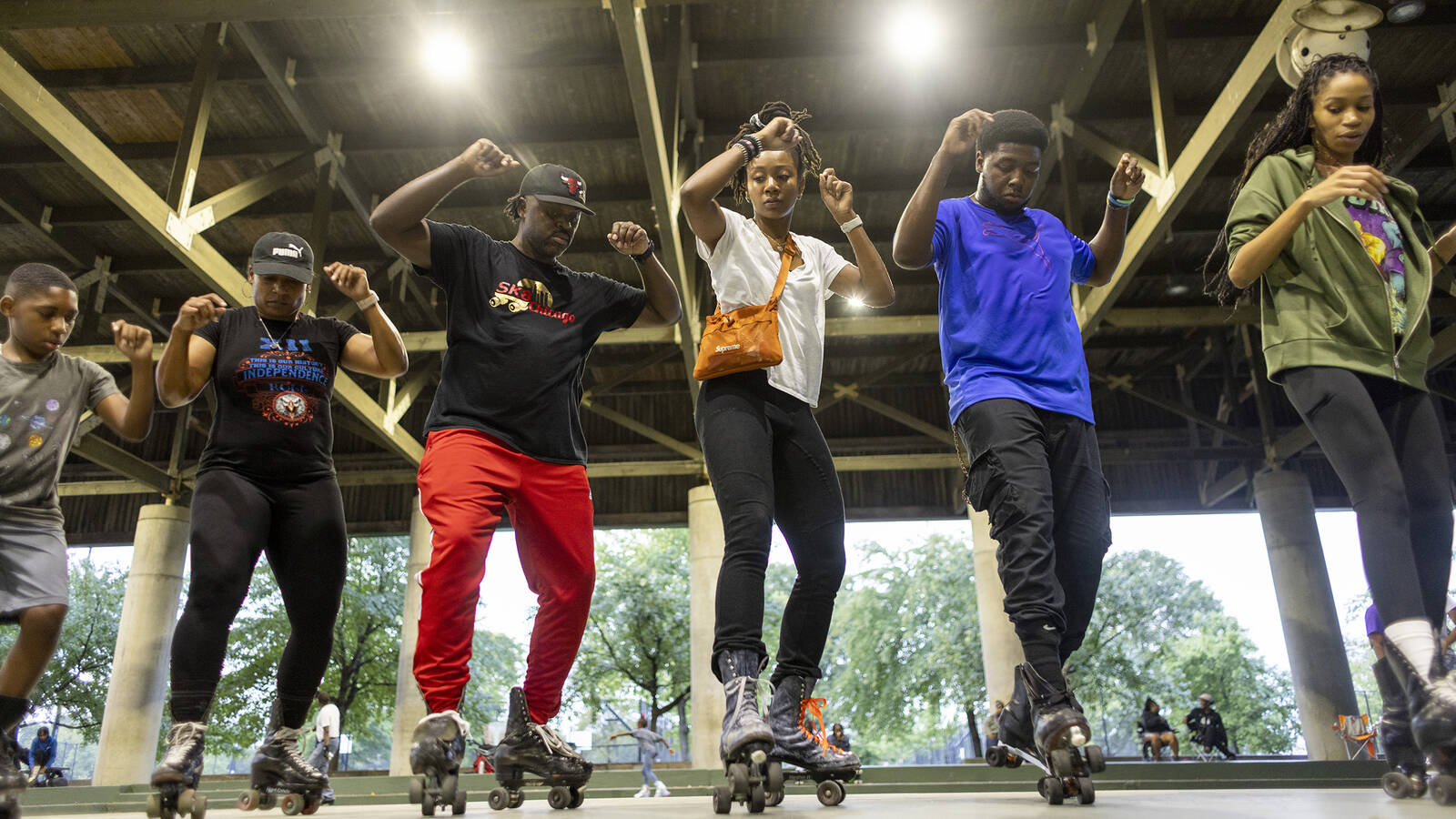 <p>Roller skaters line dance at the park's skating pavilion.</p>