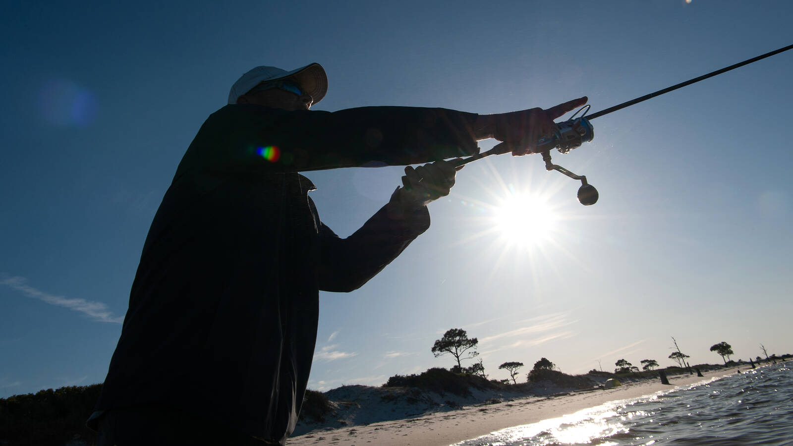 <p>A visitor fishing. It’s a rare sight because Horn Island is so hard to reach, Doyle said.</p>