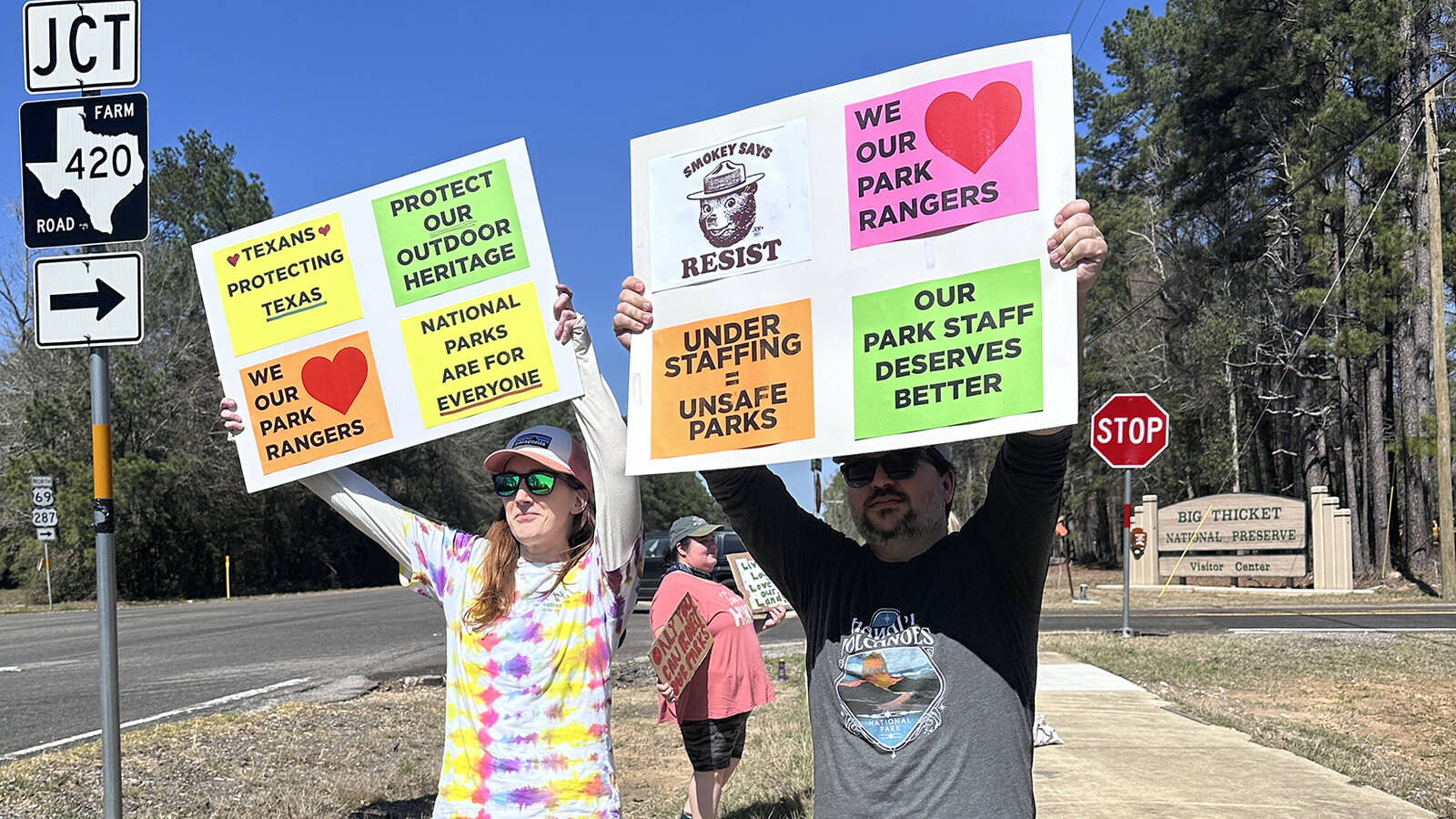 <p>National park supporters wave signs outside Big Thicket National Preserve in Texas in early March. </p>