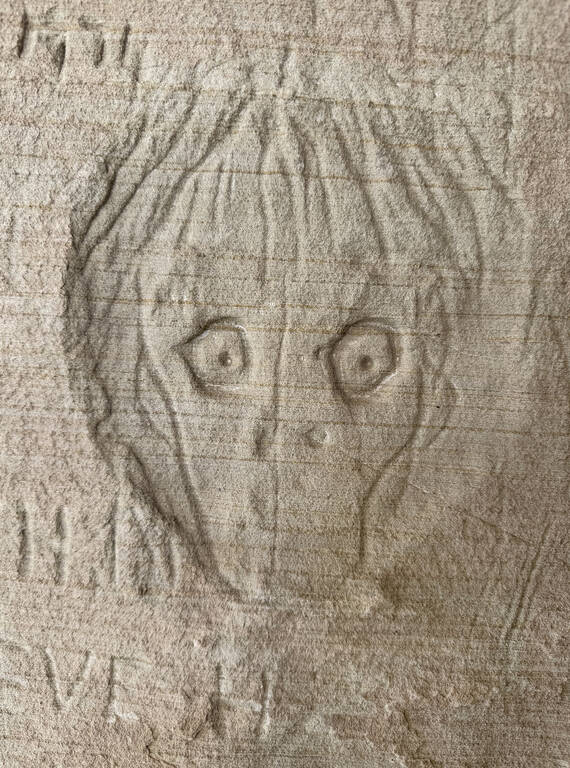 <p>Interspersed amid the engraved names and dates along Glen Canyon's walls are drawings, such as this one, reminiscent of Edvard Munch’s “The Scream.” </p>