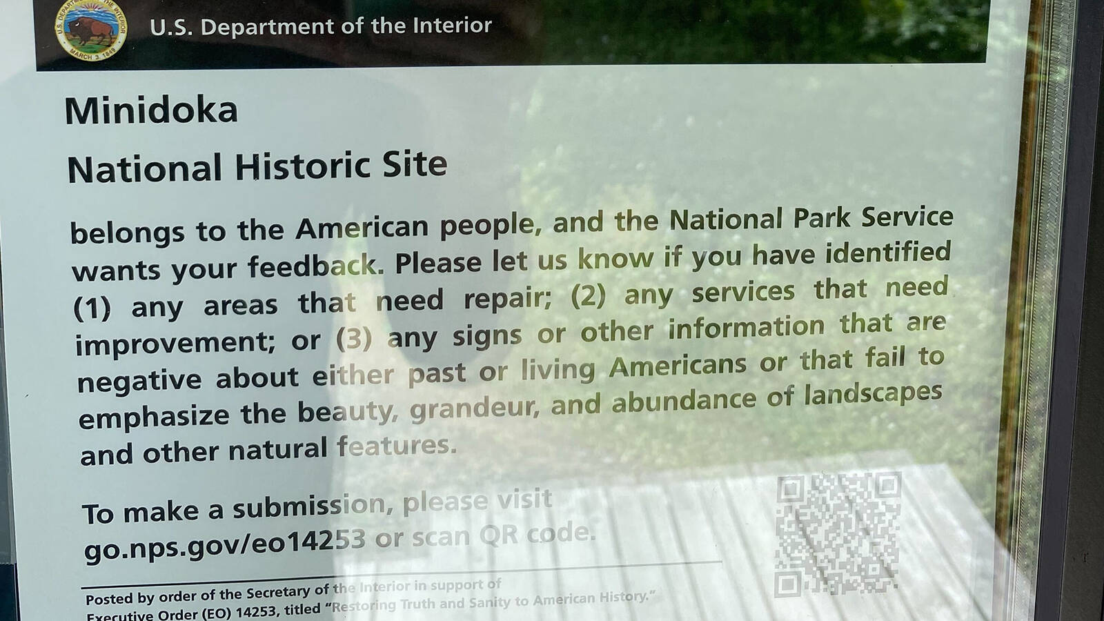 <p>A Department of the Interior sign posted at Minidoka National Historic Site, as well as every other national park site, asking visitors to report areas that need repair, services that need to be improved or information that is negative about past or living Americans.</p>