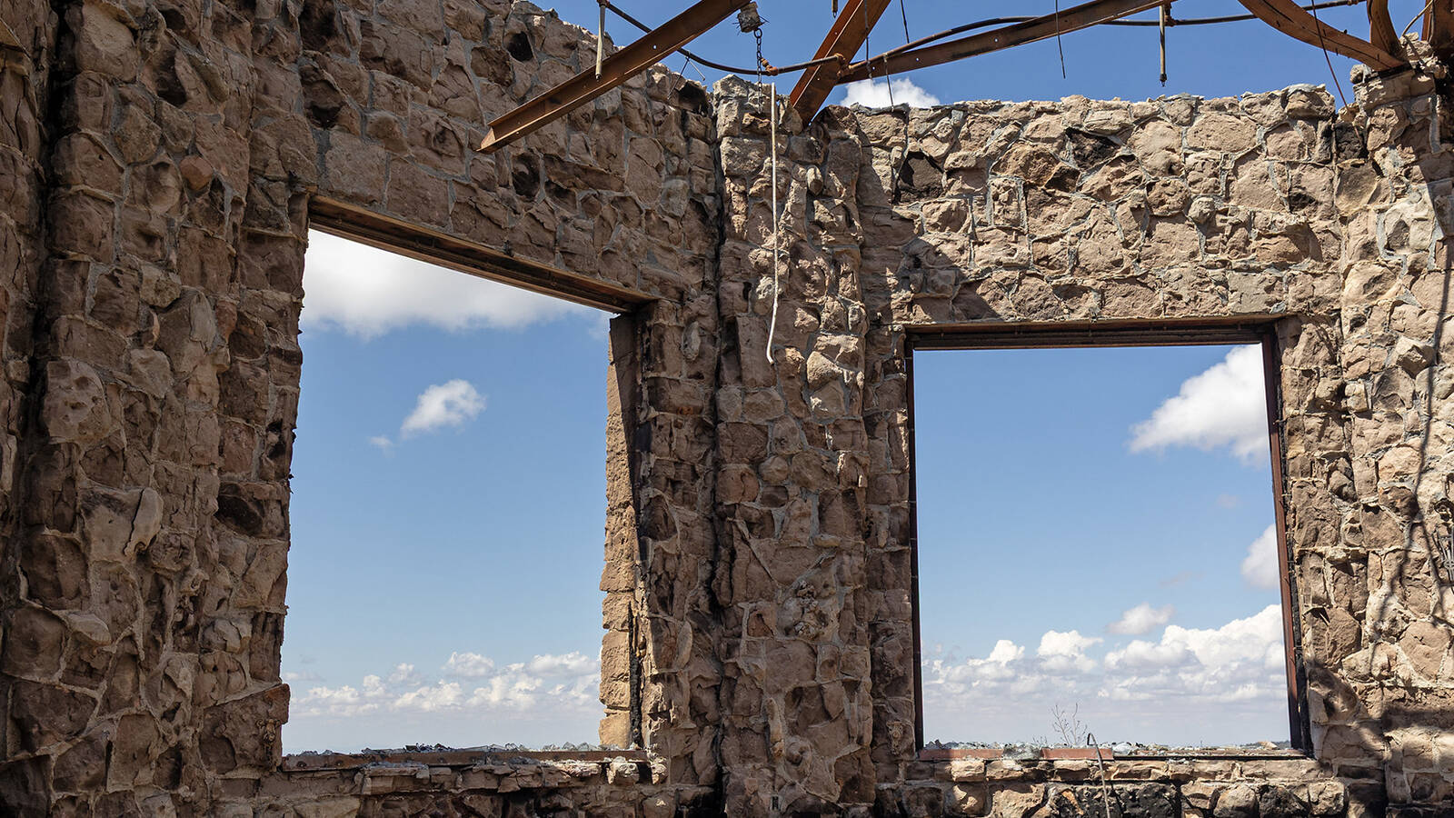 <p>Remaining walls of the Grand Canyon Lodge Sun Room after the lodge was destroyed by the Dragon Bravo Fire July 12-13, 2025. </p>
