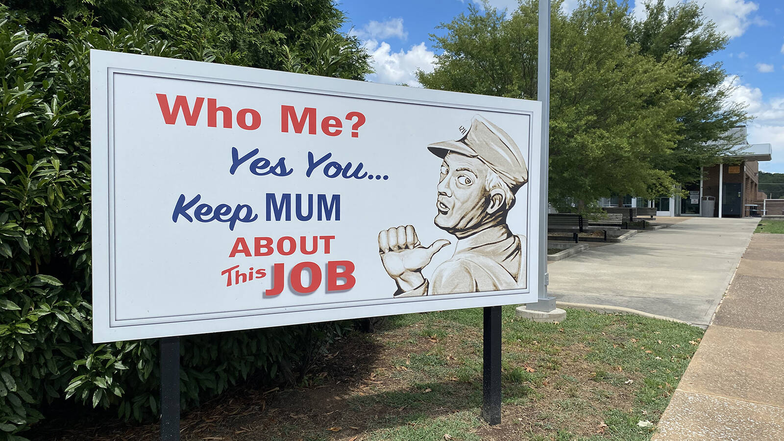 <p>Replica of a World War II-era billboard at the K-25 History Center, part of Manhattan Project National Historical Park in Oak Ridge, Tennessee. It reads "Who Me? Yes You ... Keep Mum About This Job."</p>