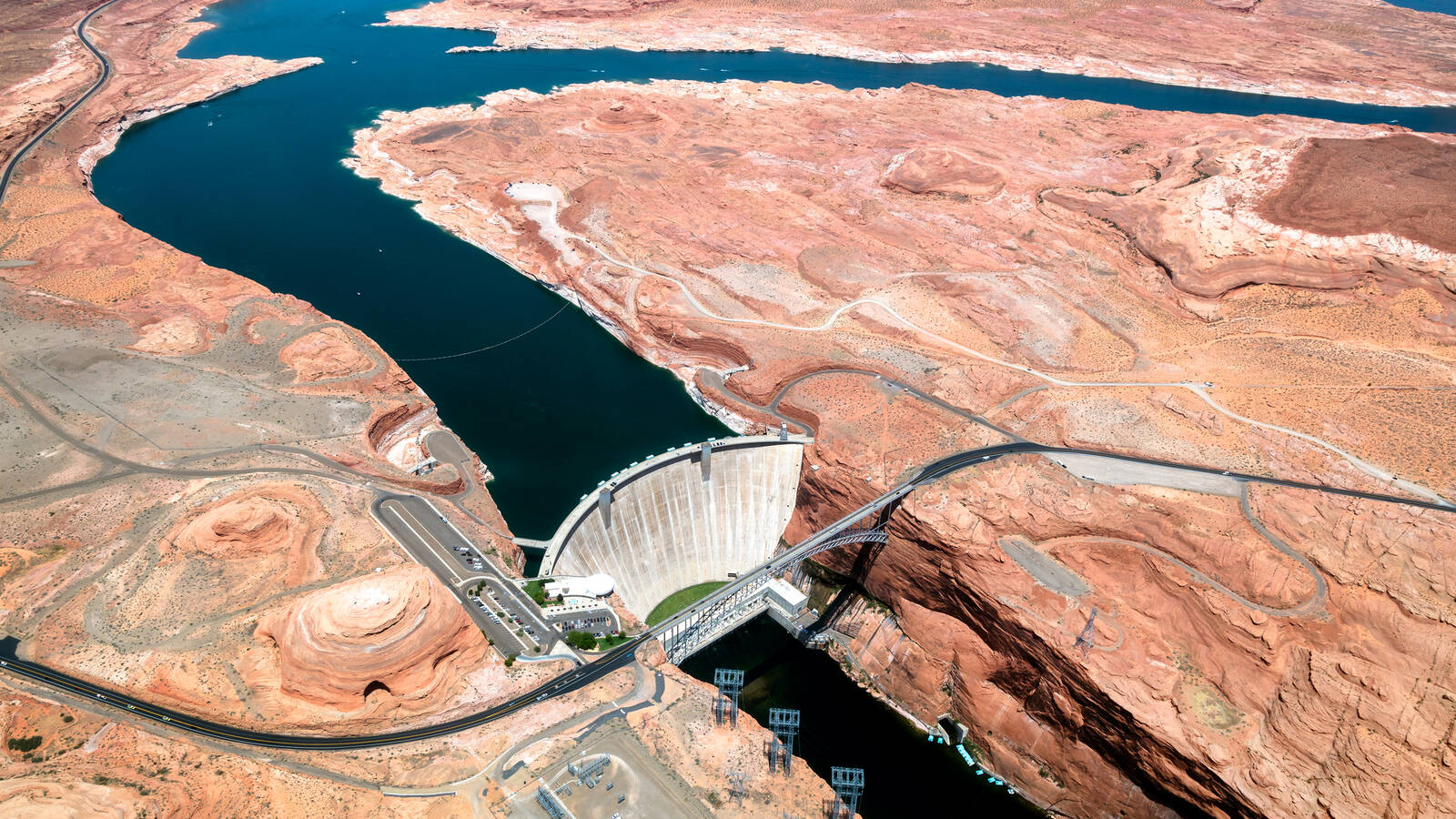 <p>Glen Canyon Dam was completed in 1963. As the reservoir filled, it smothered rapids miles upriver, including in Cataract Canyon.</p>
