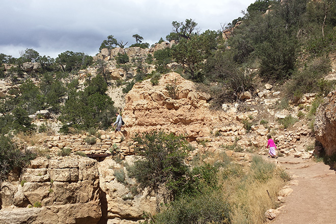 The author's brother and five-year-old niece enjoy a hike at Grand Canyon National Park—focused on totally different things. Photo © Katherine McKinney.