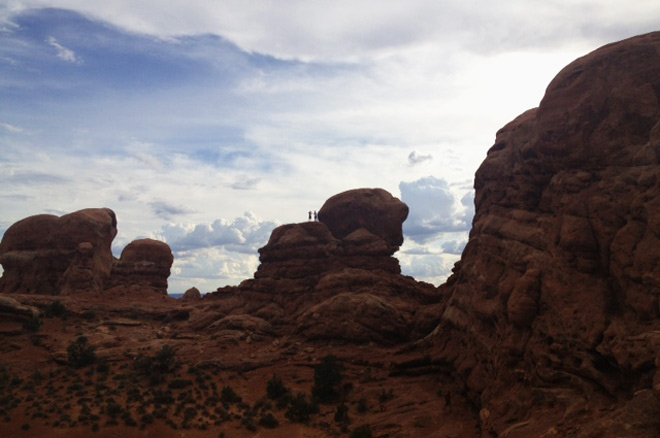 The boys enjoy scrambling over the rocks at Arches National Park
